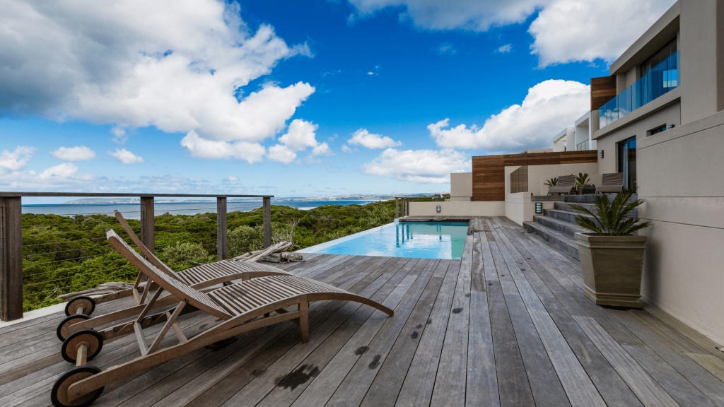 Timber deck with plunge pool and coastal view